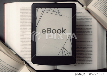 Readers. Digital e book, library reader tablet with books on dark background. Ebook, e learning electronic internet mobility concept. 85774953