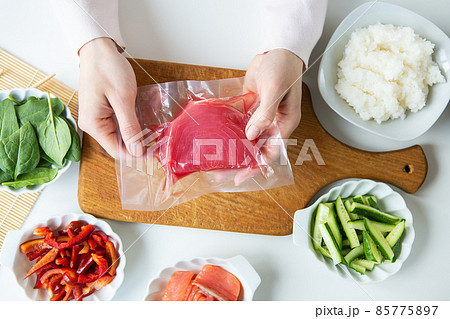 In the process of making sushi, preparing all the ingredients for sushi, tuna in a vacuum. View from above. 85775897