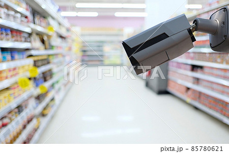 CCTV camera on supermarket background. CCTV camera on supermarket background. 85780621