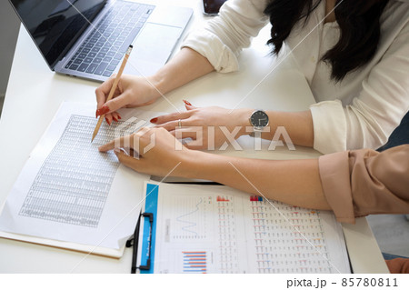 Close-up image of an accountant analysing financial data in spreadsheet. Close-up image of an accountant analysing financial data in spreadsheet. 85780811