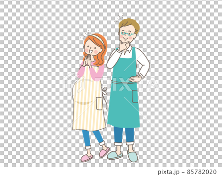 妊娠中の笑顔の女性とエプロン姿の夫 85782020