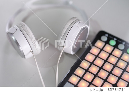 White headphones and beatbox on a gray background White headphones and beatbox on a gray background 85784754