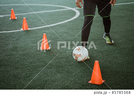 close up of a futsal player's feet dribbling the ball 85785368