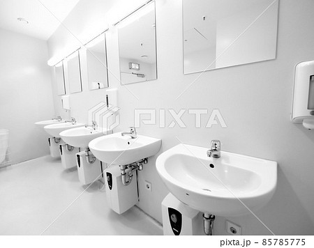 a clean new public toilet room empty a clean new public toilet room empty 85785775