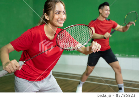 Mixed doubles badminton player with stance position ready to play 85785823