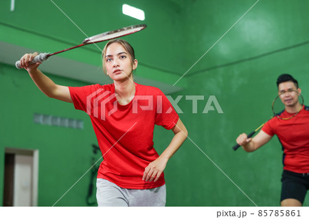 Female badminton player ready to hold the racket Female badminton player ready to hold the racket 85785861