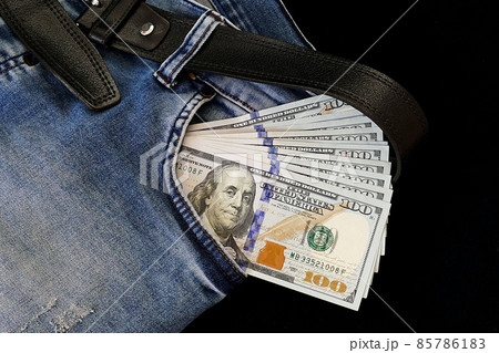 100 usd banknotes visible in the pocket of a jeans lying on the floor, your jeans and 100 usd, 100 usd banknotes visible in the pocket of a jeans lying on the floor, your jeans and 100 usd, 85786183