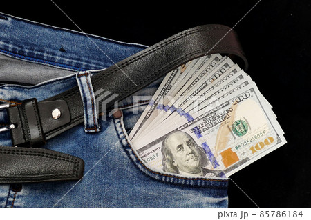 100 usd banknotes visible in the pocket of a jeans lying on the floor, your jeans and 100 usd, 100 usd banknotes visible in the pocket of a jeans lying on the floor, your jeans and 100 usd, 85786184