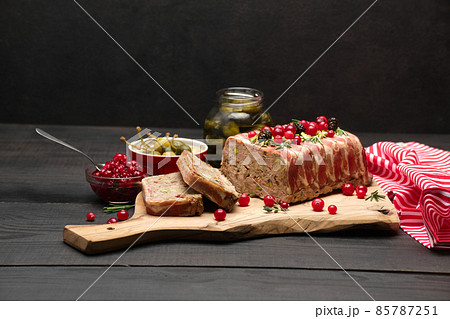 Traditional French terrine covered with bacon on dark wooden background 85787251