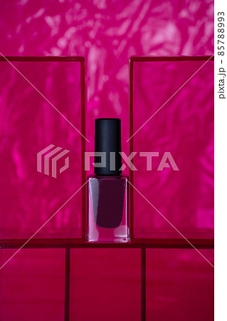 Dark pink bordo nail polish on pink background 85788993