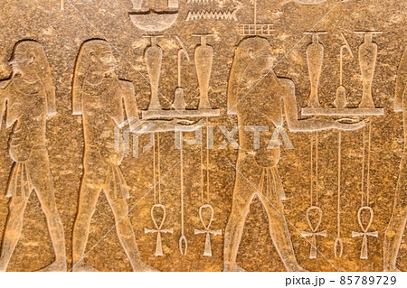 Ancient egyptian paintings and hieroglyphs carved on the stone wall Ancient egyptian paintings and hieroglyphs carved on the stone wall 85789729
