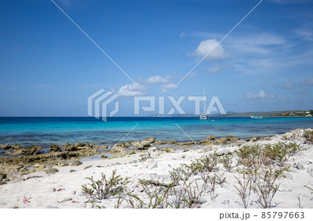 Deserted coral beach with turquoise colour sea. Beautiful seascape. Deserted coral beach with turquoise colour sea. Beautiful seascape. 85797663