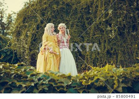Portrait of two blonde woman dressed in historical Baroque clothes Portrait of two blonde woman dressed in historical Baroque clothes 85800491