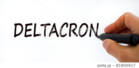 New covid-19 deltacron variant strain symbol. Doctor hand with black marker. The concept word Deltacron. Medical and COVID-19 deltacron variant strain concept. Copy space. 85800917