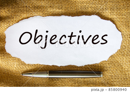 Objectives symbol. The concept word 'Objectives' on white paper. Black metallic pen. Beautiful canvas background. Business and objectives concept. 85800940