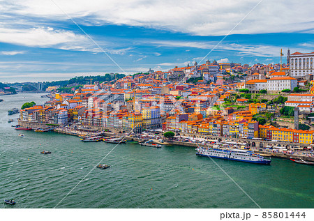Aerial panoramic view of Porto Oporto city historical centre with Ribeira district colorful buildings houses on embankment of Douro River 85801444