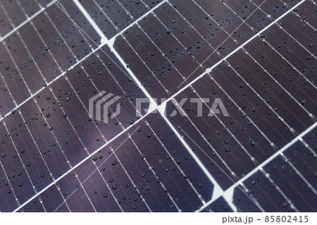 Solar panels blue background, texture. Close-up of blue solar panel with water drops. Solar panels blue background, texture. Close-up of blue solar panel with water drops. 85802415