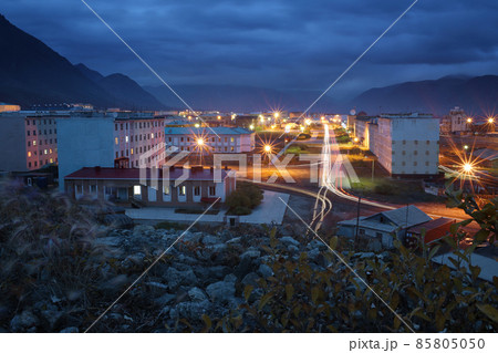 Beautiful night city landscape. Top view of the buildings and streets of a small Arctic port town Beautiful night city landscape. Top view of the buildings and streets of a small Arctic port town 85805050