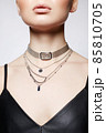 Beautiful young woman with elegant necklace 85810705