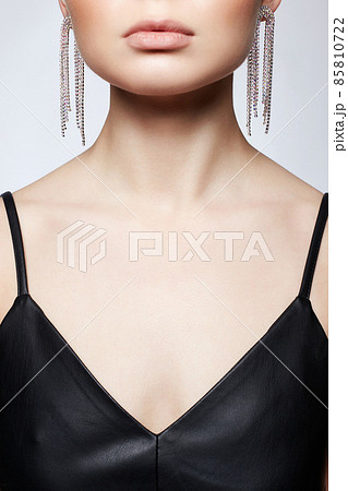 Beautiful young woman with jewelry earrings 85810722