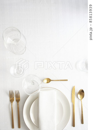 Tableware background in white gold tone. 85813939