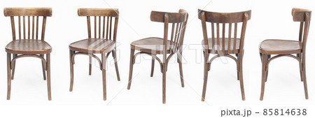 Set of wooden chairs from the turn of 70's and 80's from the previous century in dark brown color. Polish design and production. View from each side Set of wooden chairs from the turn of 70's and 80's from the previous century in dark brown color. Polish design and production. View from each side 85814638