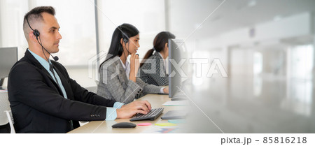 Business people wearing headset working in office broaden view 85816218