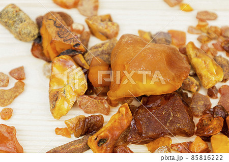Amber. There are many different transparent pieces of amber, small and large, Ancient wood resin as a mineral for jewelers. The Sunstone Amber. There are many different transparent pieces of amber, small and large, Ancient wood resin as a mineral for jewelers. The Sunstone 85816222