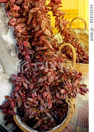 red dry hot chili peppers hanging on market for sale. Concept of street trade in spices 85816334