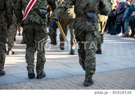 Soldiers march in parade step in full uniform. Rear view. Soldiers march in parade step in full uniform. Rear view. 85816536