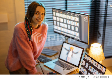 Photographer editing photos at home office 85816664