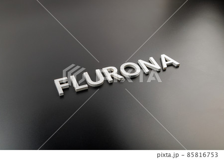 the word flurona laid with silver metal letters on gloss black background 85816753