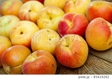 Image of delicious ripe apricots fruit on wooden surface Image of delicious ripe apricots fruit on wooden surface 85819262