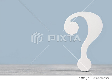 White question mark symbol on a gray desk on blue White question mark symbol on a gray desk on blue 85820259