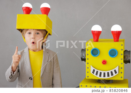 Happy child playing with robot 85820846