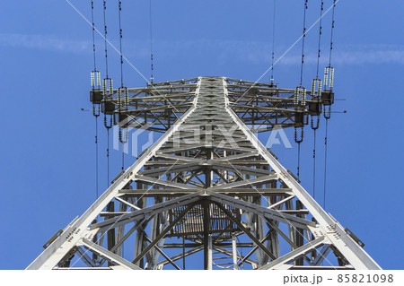 Tall electric tower for power transmission against the sky Tall electric tower for power transmission against the sky 85821098