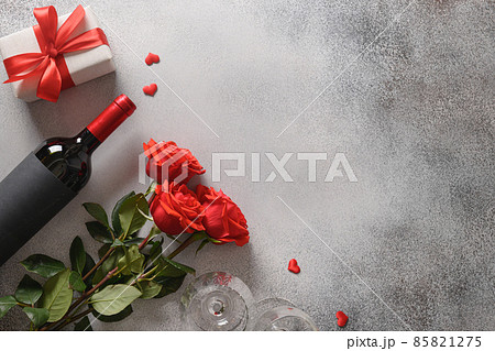 Valentine's day greeting card with red roses and wine and hearts gift. Valentine's day greeting card with red roses and wine and hearts gift. 85821275