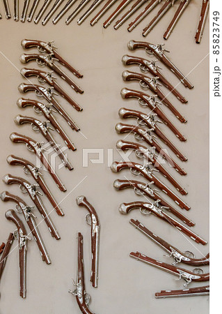 Collection of the many vintage flintlock pistols 85823749