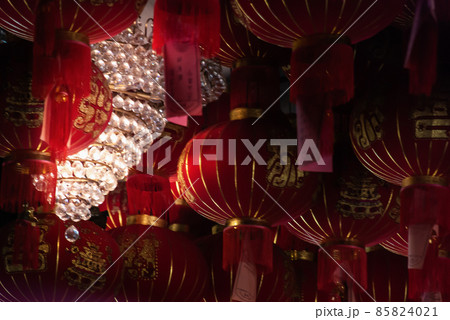 Many red Chinese lanterns in Interior at temple 85824021
