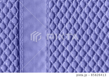 Background of textile mesh over cotton jersey. Macro. Background of textile mesh over cotton jersey. Macro. 85826413