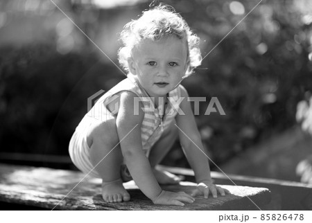 Beautiful baby boy in child garden posing photographer 85826478