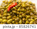 Green olive salad background with a chilli on top 85826741