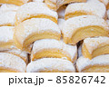 Delicious pastry with icing on top filling the scene 85826742