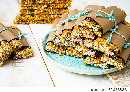 Granola bars Front view , with copy space. Front view , with copy space. Homemade healthy snack , concept superfood , active lifestyle, sports, healthy food, baby food, healthy breakfast and snack. Granola bars Front view , with copy space. Front view , with copy space. Homemade healthy snack , concept superfood , active lifestyle, sports, healthy food, baby food, healthy breakfast and snack. 85828388