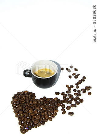 Coffee beans laid out in the shape of a heart on a white background. Isolate. Lifestyle 85829080