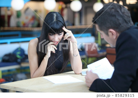 Businesswoman and businessman HR manager interviewing woman. Candidate female sitting interviewers on background. Human resources,Young attractive woman during job interview Businesswoman and businessman HR manager interviewing woman. Candidate female sitting interviewers on background. Human resources,Young attractive woman during job interview 85829315