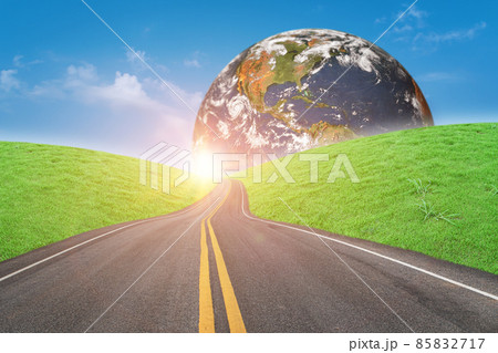 Asphalt road and green grass field forward to globe on sunny day Asphalt road and green grass field forward to globe on sunny day 85832717