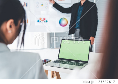 Businesswoman in business meeting using computer proficiently at office room . 85832817