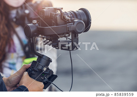 Motorized Gimbal, people using digital camera with anti shake for video production scene stabilizer 85839559