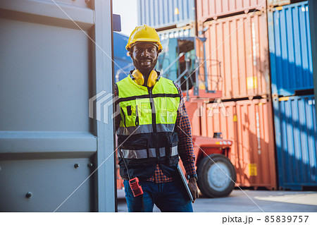 Portrait custom staff worker happy smile working in cargo shipping logistic port. Portrait custom staff worker happy smile working in cargo shipping logistic port. 85839757